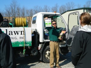 Jimmy Torres, Green Lawn's service manager, reviews all customer information, including lawn flags that technicians leave at a customer's home.