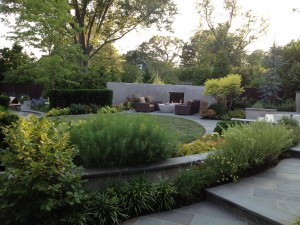 Fireside chats. Beyond the pool, a gently curved wall features a contemporary fire feature—ideal for after-dinner gatherings.