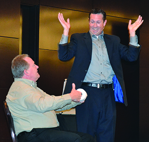 Headshot: Speaker and magician Jon Petz had some fun with John Deere’s Segment Marketing Manager Ken Taylor.