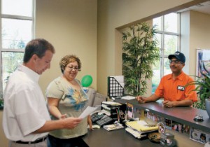 Maria Anaya assists Tom Jurasinksi, a manager at Kujawa Enterprises, Inc. (KEI), with some documents needing to be explained to employee Abel Chairez. Anaya understands the cultural issues that could inhibit effective communication between KEI management and the company’s native Spanish-speaking workers.