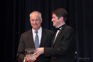 Craig Ruppert (left) receives the 2013 Catholic Business Person of the Year award from Gerard McLoughlin (right). Photo: Ruppert Landscape.
