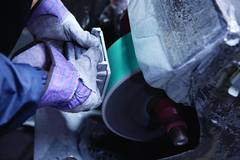 A Vista employee polishes step light. Photo: Vista