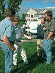 NaturaLawn staff trains some of its franchisees in the field. Photo:Phillip Catron