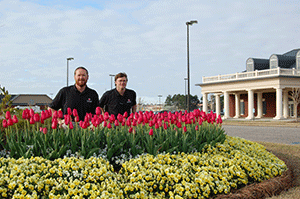 Kyle Faulk, left, and his brother, Grant, say their new bonus program has motivated their workers.