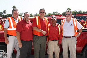 ValleyCrest leaders congratulate truck giveaway winners Jose Carillo.