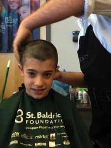 Nate Stoltman participates in St. Baldrick's