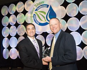 Michael Dukes (right) receives the Irrigation Assocation Excellence in Education Award at the 2014 Irrigation Show & Education Conference from J.R. Bergantino. Photo: Irrigation Association