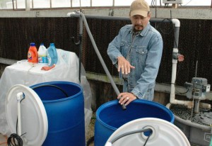 Raul Cabrera demonstrates some intricacies of his research project, "Use of Alternative Irrigation Water Sources for Urban Landscapes and Nursery Crops." Photo: NENA