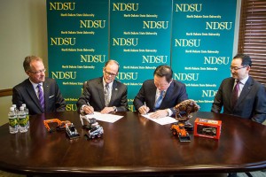 From left: Rich Goldsbury, president of Bobcat and Doosan, North America and Oceania; Dean Bresciani, president of NDSU; YM Park, chairman of Doosan; Scott Park, president and CEO of Doosan Infracore Bobcat Holdings Co. Photo: Bobcat