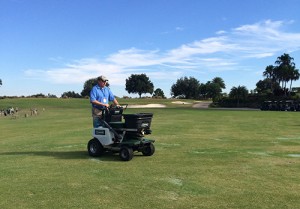 Jason Collins, regional sales manager for Turfco, demonstrates its spreader/sprayer at the 2014 LM Lawn Care Forum in Orlando, Fla. Photo: LM