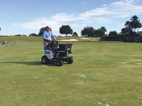 Jason Collins, regional sales manager for Turfco, demonstrates its spreader/sprayer at the 2014 LM Lawn Care Forum in Orlando, Fla. Photo: LM