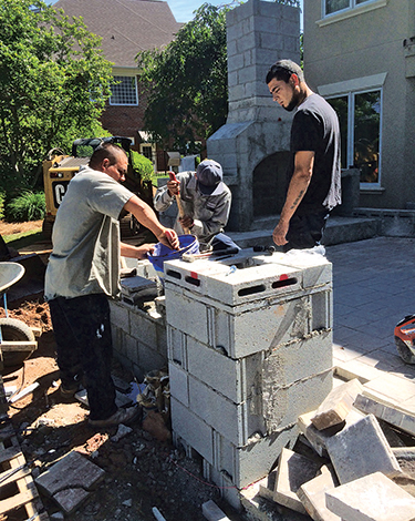Qualified employees, like this hardscape crew at LandCare Innovations, are hard to come by.