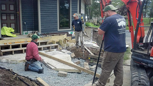 David DeFranco, Randy West and Jesse Clark construct a flagstone walkway. Photos: DeFranco Landscaping