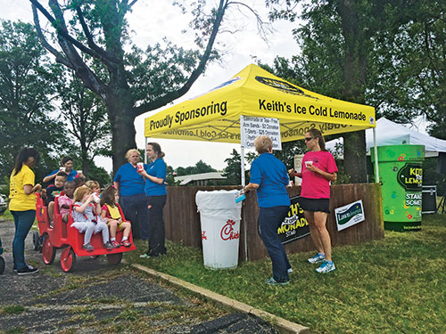 Last summer, the LawnAmerica team sponsored and staffed a charity lemonade stand. Photo: LawnAmerica