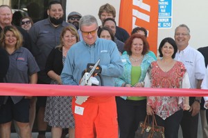 Larry Blamer, Stihl branch manager, cut the ribbon with a Stihl MSA 200 C-BQ lithium ion chainsaw.