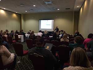 Real Green's Joe McPhail presents to a crowded room of attendees during day one of Solutions 2016.