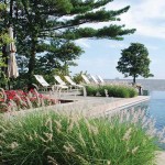 The raised terrace functions as the perfect sunbathing area, framed and softened by thoughtfully planted Oriental Fountain Grasses.