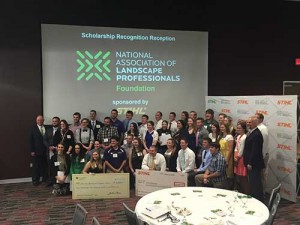 Rodger Phelps of Stihl poses for a picture with the 53 Foundation Scholarship recipients. Stihl sponsored the event.