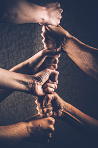 iS78951315stacked-hands Photo: ©istock.com/Redrockschool