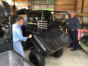 Bello demonstrates how the CrewMaster attachment still affords full use of the UTV's bed.