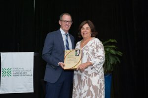 Abby Santos receives NALP’s Woman Entrepreneur of the Year Award from Scott Jamieson.