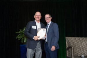 Jim McCutcheon receives the NALP Lifetime Leadership Award from Scott Jamieson.