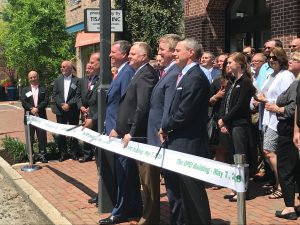 OPEI board cuts ribbon on new building.