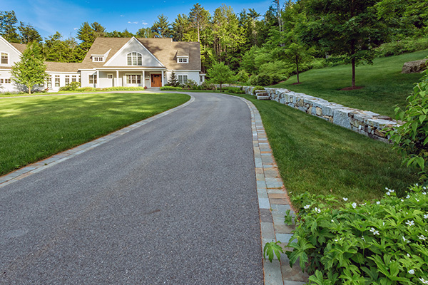 After shot of asphalt driveway entrance 