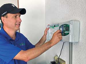 Man checking irrigation system