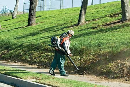 Man using backpack blower