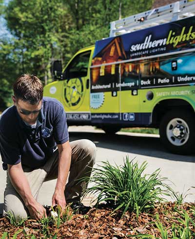 Man installing lighting (Photo: Southern Lights of N.C.)
