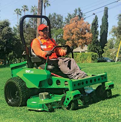 Man on a mower (Photo: LandCare Pasadena)