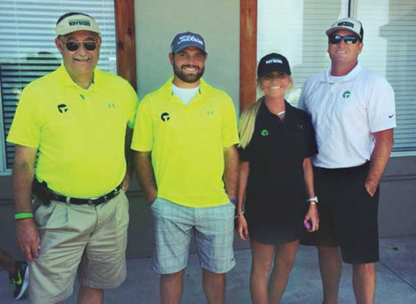 Regina Bozalis and members of Turf Team Outdoor Scapes; Photo: Regina Bozalis