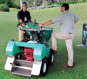 <strong>Made in the shade</strong> Rob Edwards, VP of operations for Turfware, discusses the TR360 ride-on spreader-sprayer. (Photo: Seth Jones)