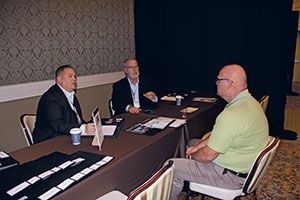 The team from Ewing Irrigation & Landscape Supply talk to Dean Bryant of Massey Services. (Photo: Seth Jones)