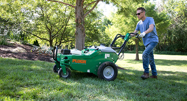 Man aerating (Photo: Billy Goat Industries)