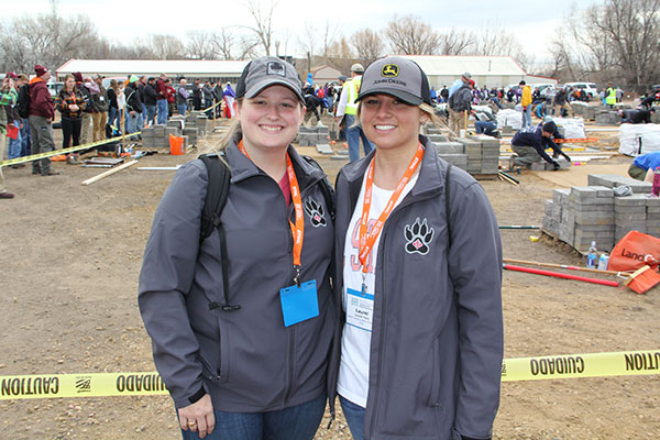 North Carolina State University students Taylor Adams and Laurel York were cheering on their fellow NCSU students at the Hardscape Installation event. (Photo: Seth Jones)