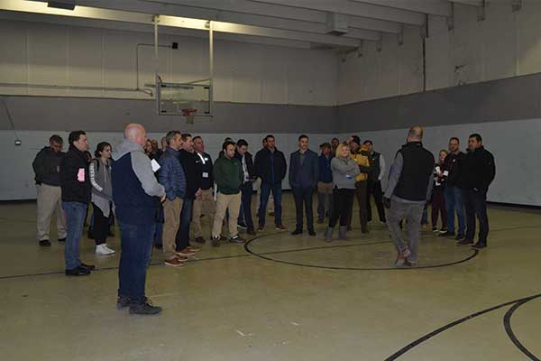Attendees were treated to a tour of Lifescape Colorado's facility. The gym of the church that now serves as their offices is partially used for storage. Photo by Clara Richter
