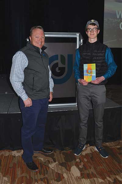 Marty Grunder, left, poses with Jayden Kazantsev, who took the day off of school to come to Grow! 2019. Photo by Clara Richter