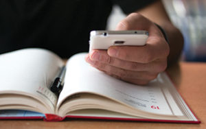 Person organizing calendar (Photo: iStock.com/ridvan_celik)