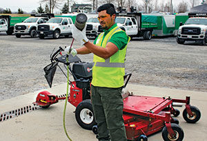 Crew member changing air filter (Photo: Ruppert Landscape)