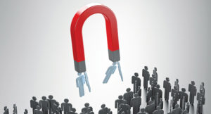 Magnet attracting people (Photo: iStock.com/onurdongel)