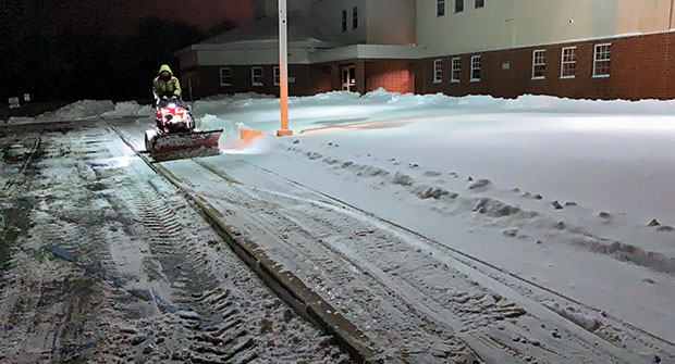 Man plowing during snowstorm (Photo: Brian Mauer)