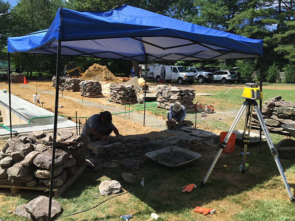 Install crews under tent (Photo: Ledden Palimeno Landscape Co.)
