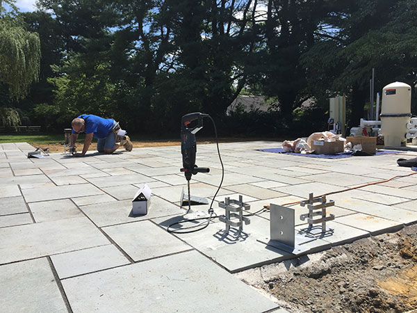 Installing hardscape (Photo: Ledden Palimeno Landscape Co.)