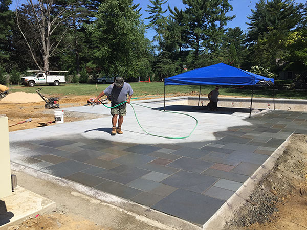 Spraying pavers (Photo: Ledden Palimeno Landscape Co.)