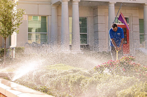 Crew member working on irrigation project (Photo: Andy's Sprinkler, Drainage & Lighting)