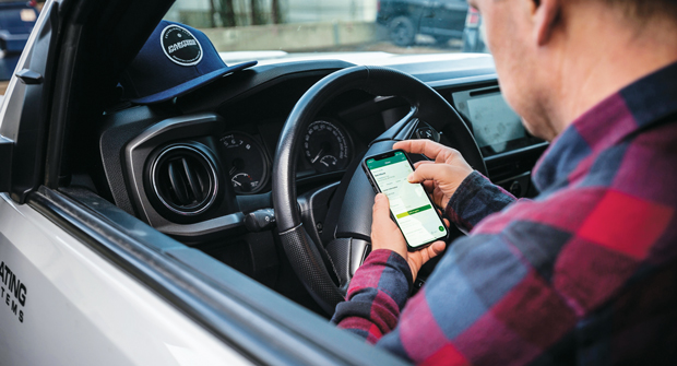 A STEP AHEAD With software, landscapers can alert customers about potential delays. Photo: Jobber