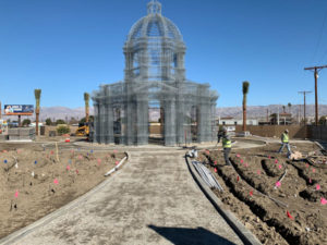 A crew installs drip irrigation, a paver base section, mow curbing and date palms. (Photo: Urban Habitat)