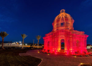 Etherea art piece stands out in striking red/orange from the surrounding date palms. LED colored lighting allowed us to showcase the art piece from the surrounding light pollution. (Photo: Urban Habitat)